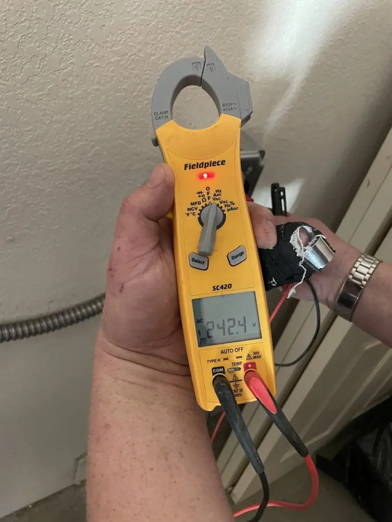 Voltage testing with clamp meter during Electrical Installation Services in Carol Stream